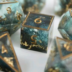 marble dices with gold numbers and designs on them