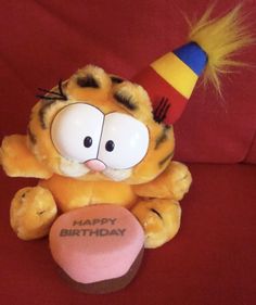 a stuffed animal with a birthday hat on