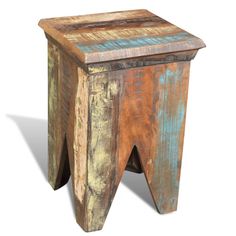 an old wooden stool with blue and yellow paint on the top, against a white background