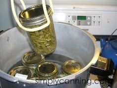 a jar filled with gold coins sitting on top of a stove next to a microwave