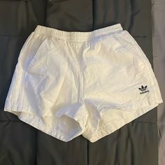 New Without Tags. 100% Cotton Shell. Three Stripe Detail On The Side. I Love These But By The Time Summer Came I Had Grown Out Of Them. They Are A Bright True White With Black Logo. Us Size Small. Please Note There Is No Stretch Other Than The Waist Band. Basic White Shorts For Spring, White Basic Shorts For Spring, Adidas Cotton Bottoms With Built-in Shorts, Adidas Bottoms For Summer Streetwear, Adidas Bottoms For Streetwear, Trendy Adidas Bottoms For Summer, Adidas Summer Streetwear Bottoms, Sporty Adidas Bottoms For Summer, Sporty Summer Adidas Bottoms