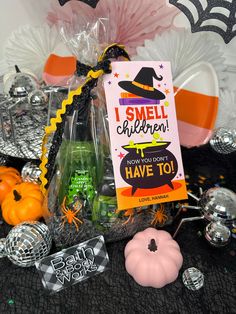 a table topped with halloween decorations and candy