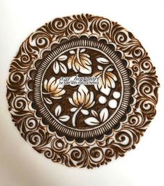 an intricately designed wooden plate with the words, love is in bloom on it