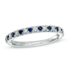 a white gold ring with blue and white diamonds