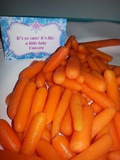 baby carrots are piled on top of each other in front of a card that says it's so cute if like a little baby unicorn