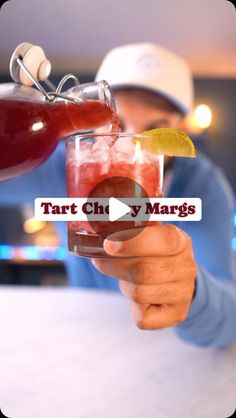 a man is holding a drink in his hand and the caption reads tart ch y'marges