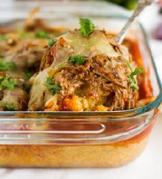 a casserole dish with meat and vegetables in it