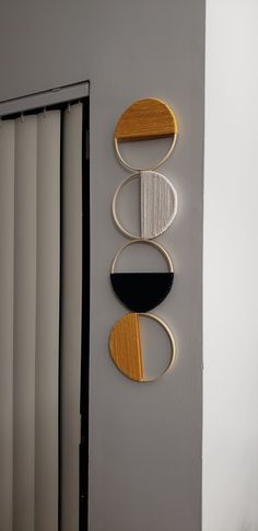 three circular objects are hanging on the wall