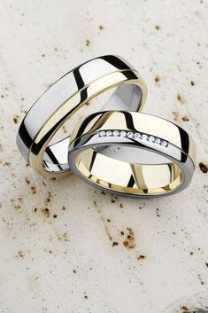 two wedding bands with diamonds on them