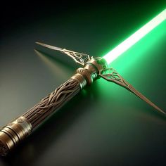 a green light saber with intricate designs on it's side and the blade lit up