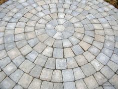 an image of a circular stone pattern in the ground that looks like it is made out of bricks