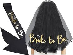 the bride to be sash is black with gold lettering on it, along with an image of a woman's head