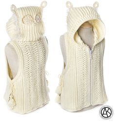 a white knitted vest with an owl on the back