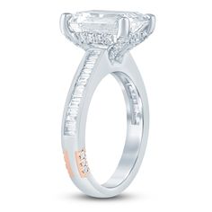 a diamond engagement ring on a white background