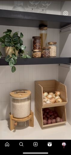 two wooden boxes filled with food on top of a counter