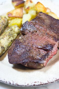 steak, potatoes and green beans on a plate