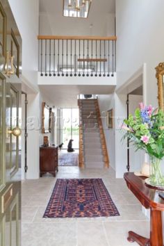 the hallway is clean and ready for us to use as an entrance way in this house