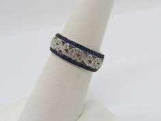 Vintage Sterling Silver Blue Sapphire & White Topaz Pave Band Ring ...Marked 925...Total of weights 3.2grams...Size 8...Measure of Band 7.7MM...It's in very good condition. Pave Band, Silver Blue, White Topaz, Vintage Sterling Silver, Band Ring, Rope Bracelet, Blue Sapphire, Band Rings, Topaz