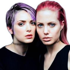 two women with pink hair and piercings posing for the camera