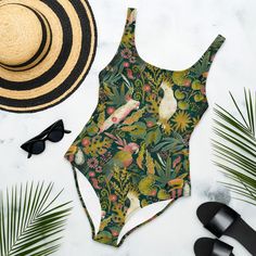 BOHEMIAN TROPICS One-Piece Swimsuit for Ladies, Tropical Parrots Swimming Suit, Floral Cockatoo Bathing Suit, Toucan Palm Leaves Swimsuit, Mystical Jungles Bathing Suit, Beach Outfit, Travel Gift Idea Prepare to be complimented! This Tropical Jungle one-piece swimsuit for all figures will bring out your best features. Enjoy the smooth fabric and the flattering design, and show it off by the sea or pool! Don't blame yourself for being so beautiful and proudly stay out of a crowd!  This Floral Par Cheap Tropical Style Bodysuit For Vacation, Affordable Casual Tropical Print Swimwear, Cheap Women's Tropical Swimwear, Cheap Tropical Bodysuit For The Beach, Affordable Tropical Bodysuit For Beach, Cheap Tropical Bodysuit For Beach, Cheap Tropical Print Swimwear For Summer, Cheap Floral Print Beachwear Bodysuit, Cheap Tropical Style Sleeveless Swimwear