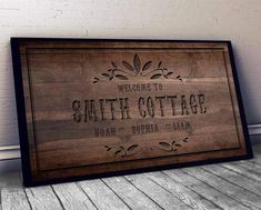 a wooden sign that says welcome to south cottage