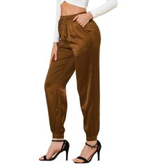 This stretch satin jogger take on a realxed silhouette for the new season, with sports tailoring with tassel drawcord gives it a new fashionable elevated twist. With Sneekers or heels to dress down or dress up. Occassion: Daily, Casual, Sports, Workout, Lounge. Perfect choice for any casual occassion at home or day out treaveling. Please check your measurements to make sure the item fits before ordering. Size: large. Color: coffee. Gender: female. Age Group: adult. Pattern: Solid. Material: Poly Dressy Dark Brown Jogger Pants, Pocket Coffee, Planet Fashion, Loft Fashion, Athleisure Pants, Satin Joggers, Trendy Pants, Crop Dress, Joggers Pants