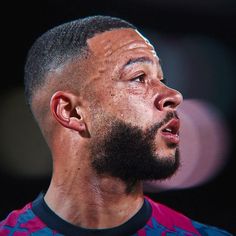 a close up of a man with a beard