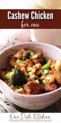 a white bowl filled with chicken and broccoli