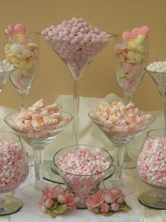 there are many different types of candies in glass bowls on the table with a quote