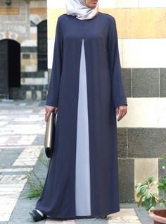 Look effortlessly chic in this simple, yet sophisticated abaya, created from a high quality rayon. Pretty and practical, the loose drape is as comfortable as it is modest. Clean lines and a smart contrasting double layered skirt add to the casual and carefree feel. Wear yours with a colorful hijab and fun purse for that perfect pop of personality. Elegant Long Gray Dress, Maxi Length Dress With Modesty Panel, Elegant Long Maxi Dress With Modesty Panel, Modest Long Fitted Dress, Muslim Dresses, Street Hijab Fashion, Skirt Outfits Fall, Modest Fashion Hijab, Trendy Skirts