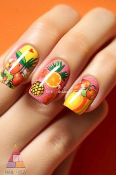 Embrace the fruity side of summer with these fun and colorful fruit-themed nails! The mix of oranges, pineapples, and other fruits will give your nails a fresh and playful look. For more summer nail colors and designs, head over to nailhow.com. Vibrant Summer Nails, Nail Colors And Designs, Themed Nails