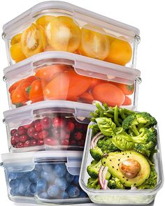 a stack of plastic containers filled with fruits and vegetables