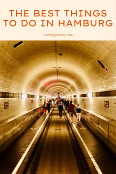 people walking through a tunnel with text overlay that reads the best things to do in hamburg