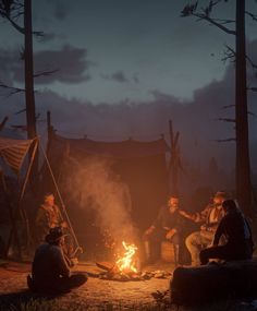 people sitting around a campfire at night