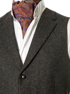 It's timeless quality makes this Irish tweed waistcoat well worth investing in if you have a penchant for classic Irish Design. This handmade tweed vest has an earthy tonal composition making it perfect for both day and evening events. The traditional herringbone peat colored tweed contains flecks of green and brown, for an immediate feel of the Irish landscape. Cut with quirky design details, it has been designed with a nod to Irish historical events. This fabric champions versatility offering Tweed Business Vest For Fall, Business Tweed Vest For Fall, Fall Business Tweed Vest, Classic Tweed Vest For Work, Tailored Single-breasted Tweed Vest, Classic Business Vest For Winter, Winter Business Tweed Vest, Business Tailored Tweed Vest, Elegant Tweed Business Vest