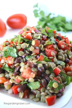 a white plate topped with black beans and veggies