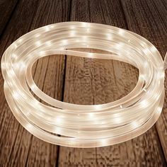 a white rope light on top of a wooden floor