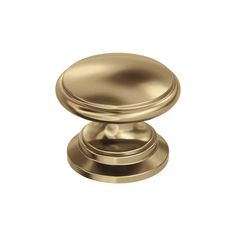 an antique brass cabinet knob on a white background