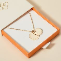 Celebrate love and connection through generations with our Personalised Grandmother Necklace. A special token to represent family and the cherished memories between a grandmother and her grandchildren, each necklace features two smooth discs to engrave with the names and dates she holds closest to her heart.&nbsp;18K Champagne Gold Plated, 925 Sterling Silver or 18K Rose Gold PlatedCharms measure: 1.5 x 1.5cm (Small Flat Disc), 1.9 x 1.9cm (Medium Flat Disc)Secure clasp fasteningCharms are r Silver Medallion Necklace For Anniversary, Mother's Day Coin Pendant Necklace, Round Pendant Necklace With Charms For Anniversary Gift, Round Pendant Necklace With Charms For Anniversary, Anniversary Necklace With Coin Pendant, Personalized Coin Necklace With Round Pendant For Anniversary, Round Disc Necklace With Engraving Option For Anniversary, Engraved Round Disc Necklace As Gift For Mom, Anniversary Necklace With Initials On Round Disc