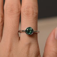 This is a gorgeous handmade creation. Its beauty is its simplicity & Elegance. The 7*7mm round cut lab green sapphire is crafted in solid sterling silver / 14k gold. It is available to customized, if you have any mind, just let me know, we will discuss with it. All item is sent in a beautiful gift box You can realize more lovely stuff clicking the link https://www.etsy.com/shop/knightjewelry?refshopsection_shophome_leftnav Please leave the correct address and you PHONE NUMBER for delivering Sterling Silver Emerald Ring With Bezel Setting, Green Promise Ring Jewelry With Round Stone, Solitaire Round Emerald Ring For Promise, Green Sapphire Ring In 14k Gold, Round Cut, Round Solitaire Emerald Promise Ring, Modern Green Round Cut Jewelry, Classic Green Bezel Set Birthstone Ring, Fine Jewelry Emerald Solitaire Ring In Round Cut, Green Sapphire Ring For May Birthstone In Sterling Silver