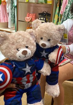 two teddy bears dressed in captain america outfits