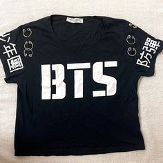 Bts T-Shirt. New, Never Worn. Black Kpop Crew Neck T-shirt, Black Kpop T-shirt Short Sleeve, Black Kpop Short Sleeve T-shirt, White Kpop Style Tops With Letter Print, Black Kpop Style Short Sleeve T-shirt, White Kpop Style Top With Letter Print, Black Short Sleeve Kpop T-shirt, Kpop Cotton Tops With Slogan, Black Kpop Letter Print Top