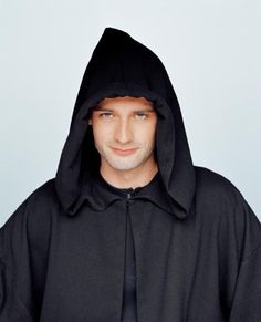 a man wearing a black hooded sweatshirt and tie