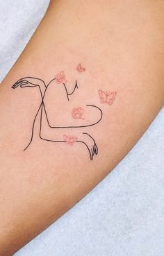 a woman's arm with a small tattoo on the left side of her body