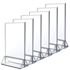 four clear acrylic displays are lined up in a row on a white background