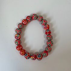 This Is A Handmade Red Clay Beaded Bracelet. This Bracelet Is Comfortable And Light To Wear, The Beads Also Feel Nice. This Is Loose Fitting But It Will Not Fall Off Your Wrist. Traditional Red Beaded Bracelets For The Beach, Casual Red Jewelry With 8mm Beads, Red Round Beads Bracelet As Gift, Traditional Red Beaded Bracelets With Large Beads, Casual Red Bracelets With 8mm Beads, Casual Red Hand-strung Bracelets, Casual Red Hand-strung Jewelry, Red Beaded Bracelets With 8mm Beads For Gift, Red Beaded Bracelets With 8mm Beads As A Gift