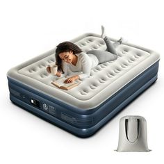 a woman laying on an inflatable mattress next to a computer mouse