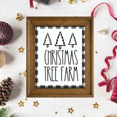 a christmas tree farm sign surrounded by holiday decorations and other items on a white background