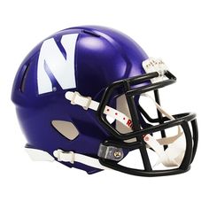 a purple and white football helmet with the letter n on it's side, against a white background