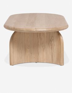 an oval wooden table with curved legs